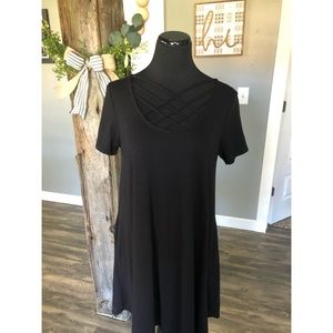 black swing dress with criss-cross detail